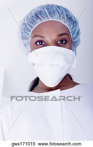 Portrait of a female surgeon wearing a surgical mask View Large Photo Image Stock Photography - Portrait of a female surgeon wearing a surgical mask. Fotosearch