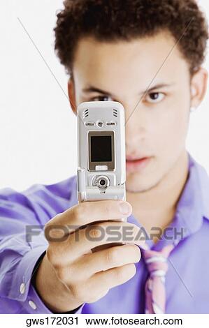 Close-up of a businessman taking a picture of himself View Large Photo Image Stock Image - Close-up of a businessman taking a picture of himself. Fotosearch