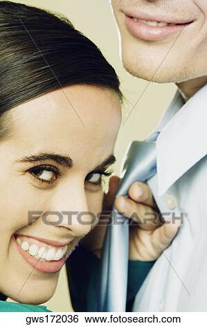 Close-up of a businesswoman holding a businessman's tie View Large Photo Image Stock Photograph - Close-up of a businesswoman holding a businessman's tie. Fotosearch
