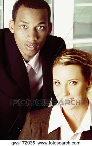 Stock Photography - Portrait of a businessman and a businesswoman. Fotosearch