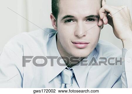 Portrait of a businessman smirking View Large Photo Image Stock Image - Portrait of a businessman smirking. Fotosearch