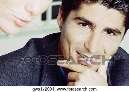 Stock Image - Portrait of a young man smiling. Fotosearch
