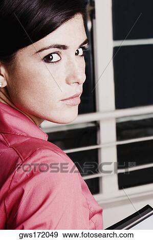 Portrait of a young woman View Large Photo Image Stock Photo - Portrait of a young woman. Fotosearch