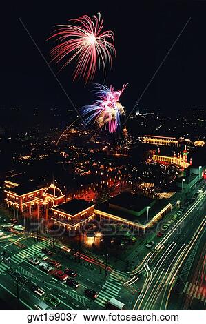 Aerial view of buildings in a city lit up at night, Tivoli Gardens, Copenhagen, Denmark View Large Photo Image Stock Photo - Aerial view of buildings in a city lit up at night, Tivoli Gardens, Copenhagen, Denmark. Fotosearch