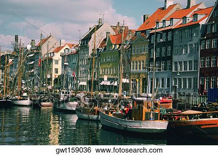 Boats in a canal in front of buildings, Copenhagen, Denmark View Large Photo Image Stock Photograph - Boats in a canal in front of buildings, Copenhagen, Denmark. Fotosearch