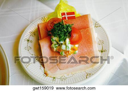 Stock Photo - High angle view of a sandwich on a plate, Copenhagen, Denmark. Fotosearch