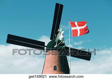 Low angle view of a windmill and the Danish flag, Funen County, Denmark View Large Photo Image Stock Image - Low angle view of a windmill and the Danish flag, Funen County, Denmark. Fotosearch
