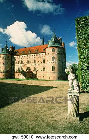 Stock Image - Statue in the courtyard of a castle, Egeskov Castle, Funen County, Denmark. Fotosearch
