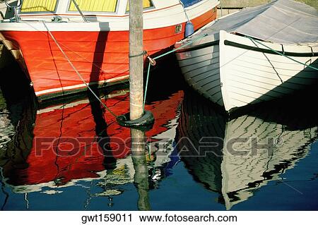 Two boats docked at the harbor, Funen County, Denmark View Large Photo Image Stock Image - Two boats docked at the harbor, Funen County, Denmark. Fotosearch