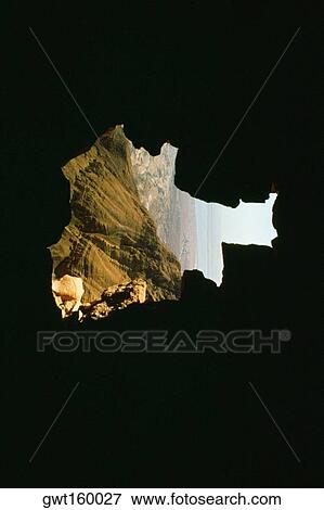 Stock Photo - Mountain viewed from a dark cave, Masada, Dead Sea, Israel. Fotosearch
