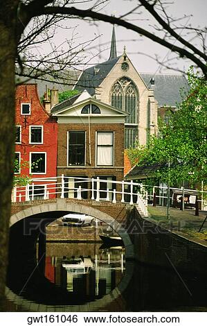 Arch bridge across a canal, Leiden, Netherlands View Large Photo Image Stock Photograph - Arch bridge across a canal, Leiden, Netherlands. Fotosearch