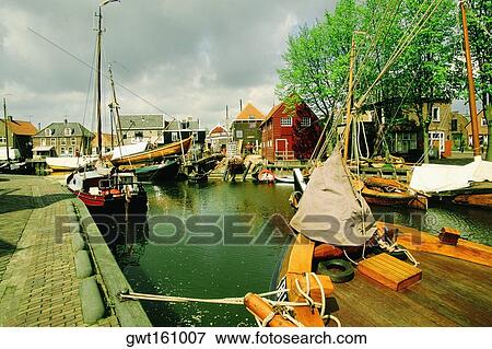 Boats moored at a harbor, Netherlands View Large Photo Image Stock Photo - Boats moored at a harbor, Netherlands. Fotosearch