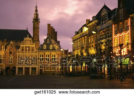 Buildings lit up at night, Town Square, Netherlands View Large Photo Image Stock Photography - Buildings lit up at night, Town Square, Netherlands. Fotosearch