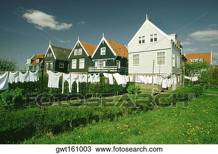 Clothes drying on a clothesline in front of houses, Marken, Netherlands View Large Photo Image Stock Image - Clothes drying on a clothesline in front of houses, Marken, Netherlands. Fotosearch