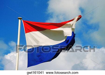 Stock Image - Low angle view of the Dutch flag, Netherlands. Fotosearch