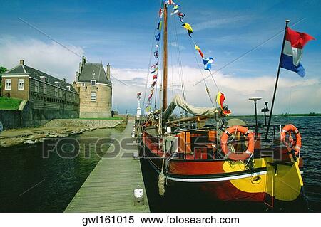 Stock Photography - Sailboat moored at a dock, Veere, Netherlands. Fotosearch