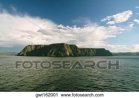 Clouds over a cliff at the waterfront, North Cape, Skarsvag, Norway View Large Photo Image Stock Image - Clouds over a cliff at the waterfront, North Cape, Skarsvag, Norway. Fotosearch