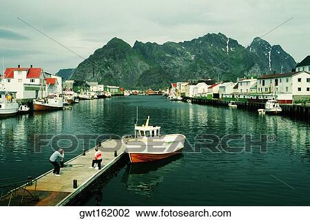 High angle view of two people on a pier, Lofoten Islands, Norway View Large Photo Image Stock Image - High angle view of two people on a pier, Lofoten Islands, Norway. Fotosearch