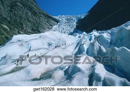 Hikers climbing a mountain, Briksdalsbreen Glacier, Norway View Large Photo Image Stock Photo - Hikers climbing a mountain, Briksdalsbreen Glacier, Norway. Fotosearch
