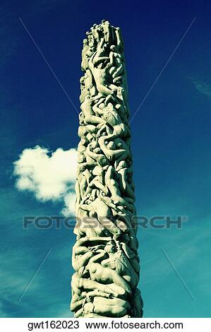 Stock Image - Low angle view of sculptures carved on a column, Gustav Vigeland Sculpture Park, Oslo, Norway. Fotosearch