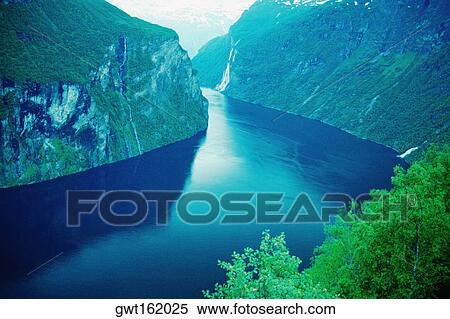 Stock Photography - River passing through mountains, Geiranger, Norway. Fotosearch