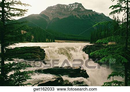 Water flowing in front of a mountain, Norway View Large Photo Image Stock Image - Water flowing in front of a mountain, Norway. Fotosearch