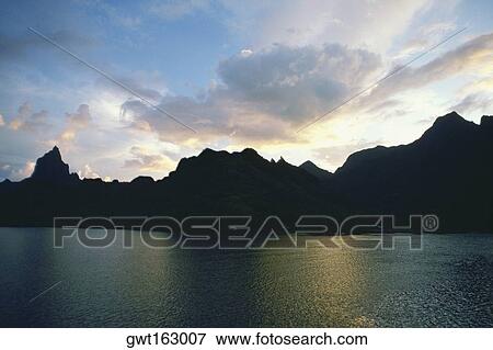 Silhouette of hills at the water front, Cooks Bay, Moorea, Society Islands, French Polynesia View Large Photo Image Stock Photo - Silhouette of hills at the water front, Cooks Bay, Moorea, Society Islands, French Polynesia. Fotosearch