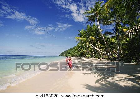 Two people standing on the beach, Fiji View Large Photo Image Stock Image - Two people standing on the beach, Fiji. Fotosearch