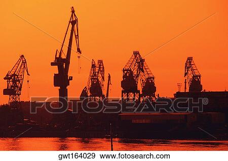 Silhouette of cranes at the harbor, St. Petersburg, Russia View Large Photo Image Stock Photo - Silhouette of cranes at the harbor, St. Petersburg, Russia. Fotosearch
