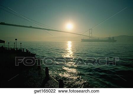 Silhouette of a suspension bridge, Bosphorus Bridge, Bosphorus, Istanbul, Turkey View Large Photo Image Stock Image - Silhouette of a suspension bridge, Bosphorus Bridge, Bosphorus, Istanbul, Turkey. Fotosearch