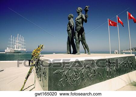 Statues at a monument with flags of Turkey, Monument of Ataturk and Youth, Kusadasi, Turkey View Large Photo Image Stock Image - Statues at a monument with flags of Turkey, Monument of Ataturk and Youth, Kusadasi, Turkey. Fotosearch