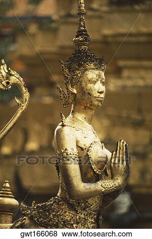 Close-up of a statue in a temple, Grand Palace, Bangkok, Thailand View Large Photo Image Stock Photo - Close-up of a statue in a temple, Grand Palace, Bangkok, Thailand. Fotosearch