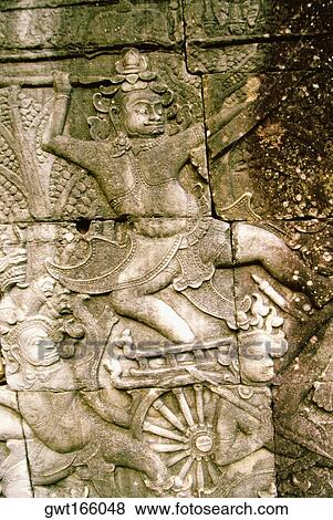 Stock Photo - Close-up of carvings on the wall, Angkor Thom, Angkor, Siem Reap, Cambodia. Fotosearch