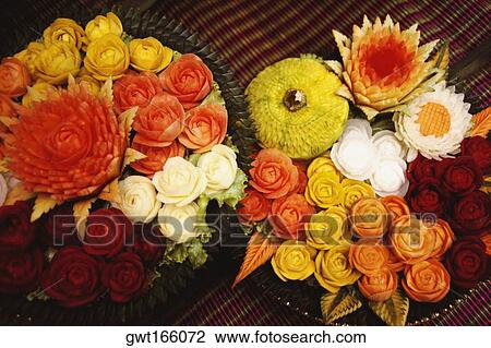 Close-up of flowers carved from vegetables View Large Photo Image Stock Image - Close-up of flowers carved from vegetables. Fotosearch