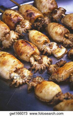 Close-up of grilled squids View Large Photo Image Stock Image - Close-up of grilled squids. Fotosearch