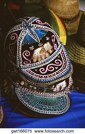 Close-up of thai-style beaded caps and hats View Large Photo Image Stock Photography - Close-up of thai-style beaded caps and hats. Fotosearch