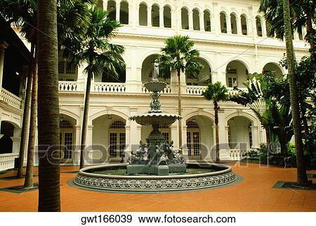Fountain in a courtyard of a hotel, Raffles Hotel, Singapore View Large Photo Image Stock Photo - Fountain in a courtyard of a hotel, Raffles Hotel, Singapore. Fotosearch