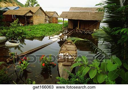 High angle view of a boat in front of a house in a flooded village, Siem Reap, Cambodia View Large Photo Image Stock Image - High angle view of a boat in front of a house in a flooded village, Siem Reap, Cambodia. Fotosearch