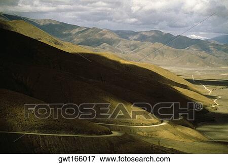 High angle view of a road running through a landscape, Katmandu Highway, Shegar, Tibet, China View Large Photo Image Stock Photo - High angle view of a road running through a landscape, Katmandu Highway, Shegar, Tibet, China. Fotosearch