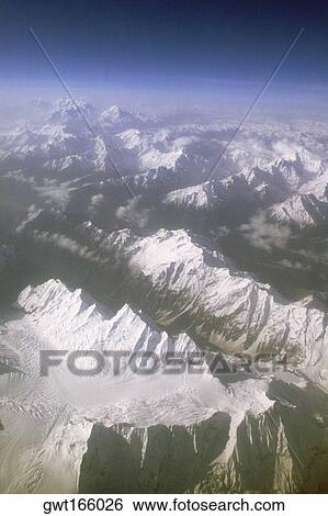 High angle view of snow covered mountains, Himalayas, Tibet, China View Large Photo Image Stock Photograph - High angle view of snow covered mountains, Himalayas, Tibet, China. Fotosearch