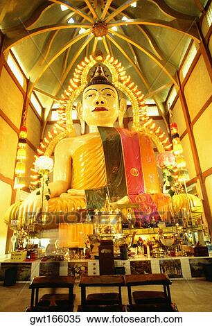 Low angle view of a statue of Buddha, Sakya Muni Buddha Gaya, Bangkok, Thailand View Large Photo Image Stock Photography - Low angle view of a statue of Buddha, Sakya Muni Buddha Gaya, Bangkok, Thailand. Fotosearch