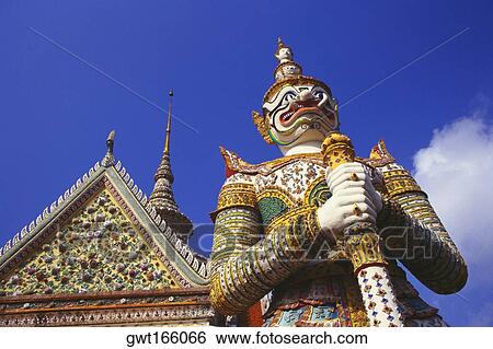 Low angle view of a statue of demon in front of a temple, Wat Arun, Bangkok, Thailand View Large Photo Image Stock Photograph - Low angle view of a statue of demon in front of a temple, Wat Arun, Bangkok, Thailand. Fotosearch