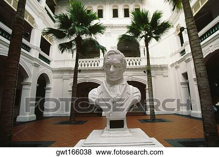 Statue of Sir Thomas Stamford raffles in a courtyard of a hotel, Raffles Hotel, Singapore View Large Photo Image Stock Photo - Statue of Sir Thomas Stamford raffles in a courtyard of a hotel, Raffles Hotel, Singapore. Fotosearch