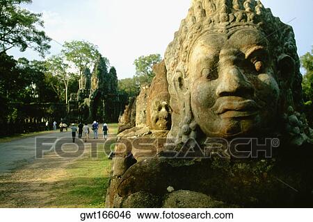 Stock Photograph - Statues in a row, Angkor Thom, Angkor, Siem Reap, Cambodia. Fotosearch