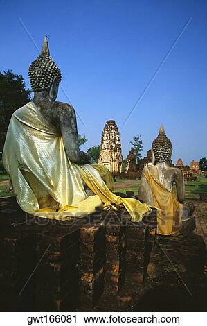 Statues of sitting Buddha at a temple, Wat Phra Phai Luang, Thailand View Large Photo Image Stock Image - Statues of sitting Buddha at a temple, Wat Phra Phai Luang, Thailand. Fotosearch