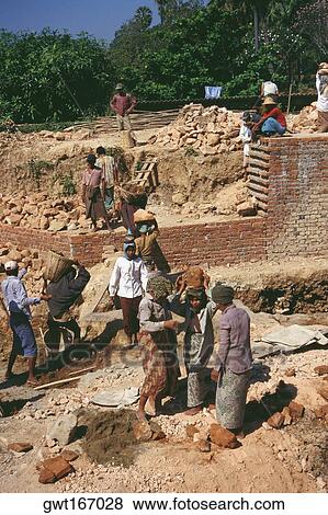 Group of manual workers working at a construction site, Yangon, Myanmar View Large Photo Image Stock Photo - Group of manual workers working at a construction site, Yangon, Myanmar. Fotosearch