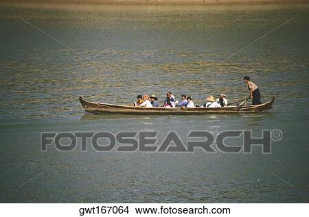 Group of people sitting in a rowboat, Ayeyarwady River, Myanmar View Large Photo Image Picture - Group of people sitting in a rowboat, Ayeyarwady River, Myanmar. Fotosearch