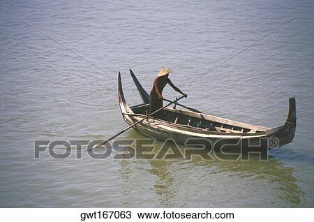 High angle view of a man rowing a rowboat in a river, Ayeyarwady River, Myanmar View Large Photo Image Stock Image - High angle view of a man rowing a rowboat in a river, Ayeyarwady River, Myanmar. Fotosearch