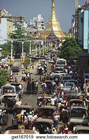 Stock Photo - High angle view of traffic on the road with a pagoda in the background, Sule Pagoda, Yangon, Myanmar. Fotosearch