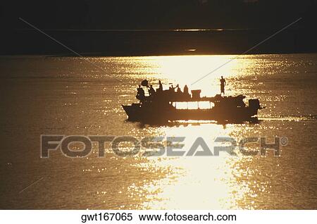 Silhouette of a ferry at sunset in a river, Ayeyarwady river, Myanmar View Large Photo Image Stock Photography - Silhouette of a ferry at sunset in a river, Ayeyarwady river, Myanmar. Fotosearch